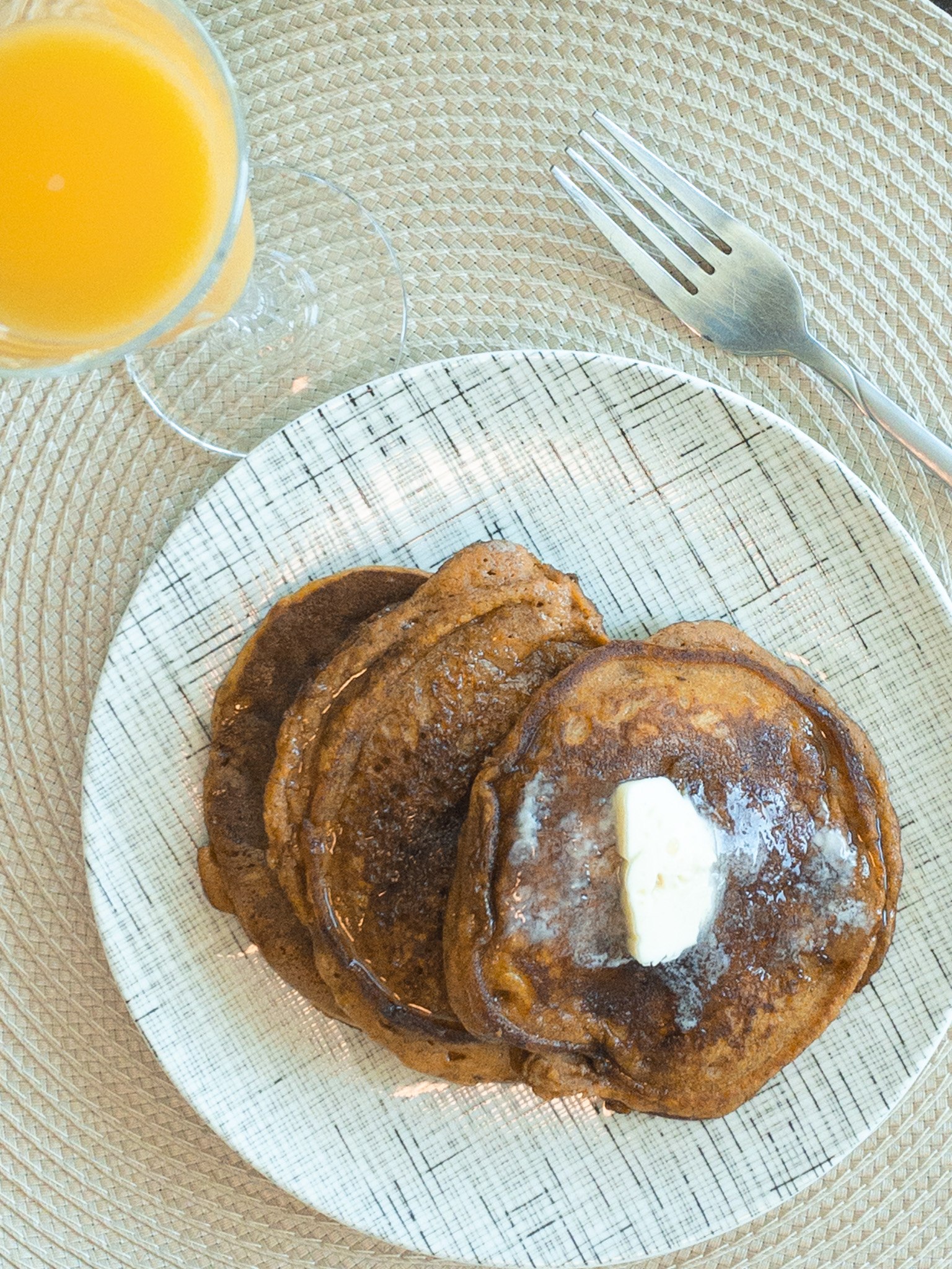 pumpkin pancakes and a glass of orange juice